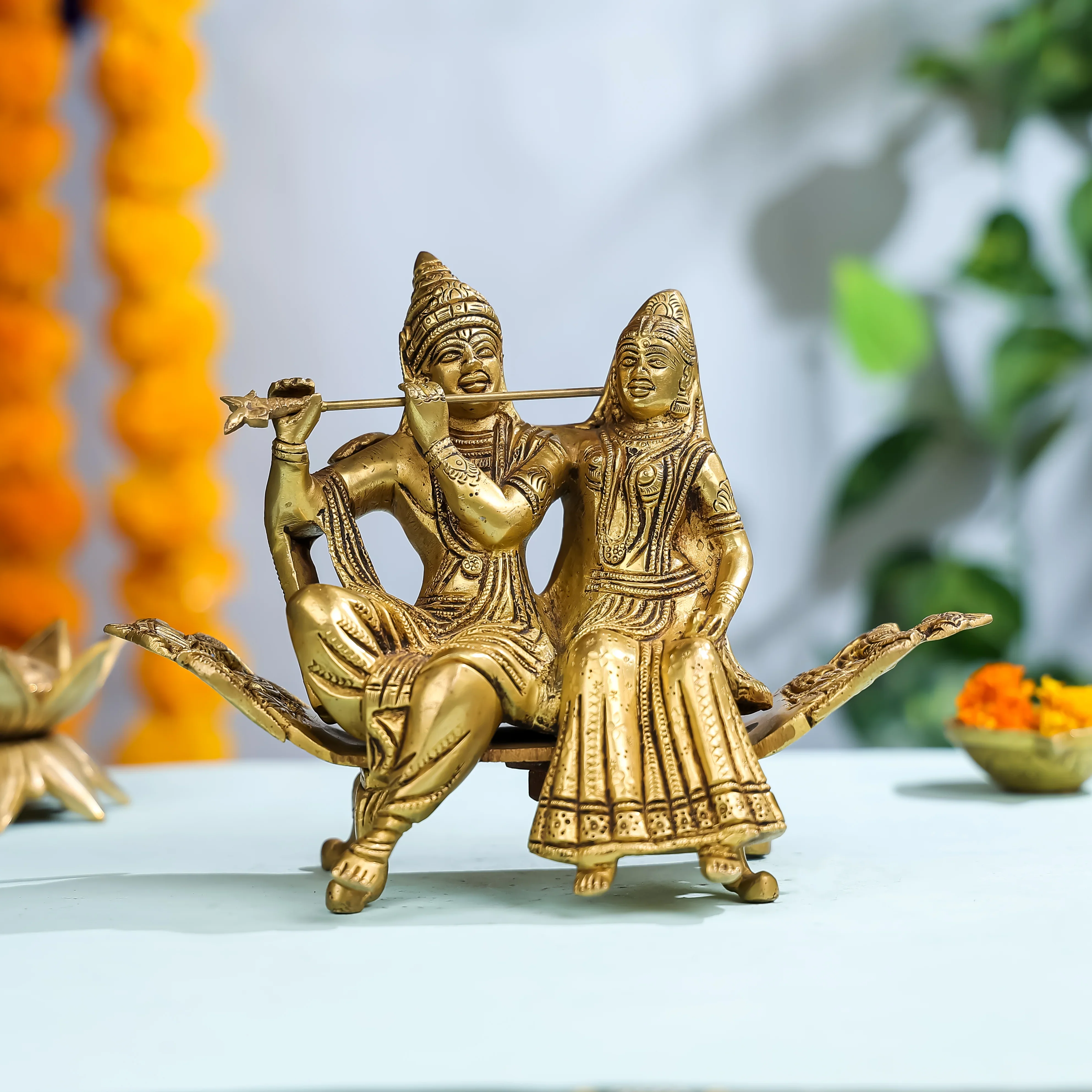 7" Brass Goddess Radha & Krishna Seated On Sofa